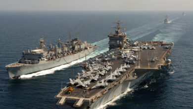 The nuclear-powered aircraft carrier USS Enterprise (CVN-65), conducts an underway replenishment with the Military Sealift Command fast combat support ship USNS Supply (T-AOE 6).