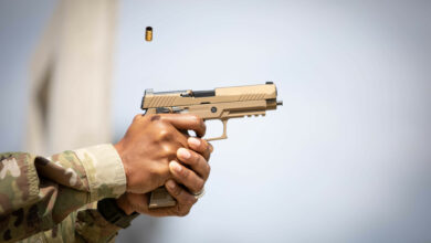 A cartridge exits the chamber after being fired from a SIG Sauer P320-M17, semi-automatic pistol during the Contract Operational Readiness Exercise (CORE) M17 qualifications at Camp Bullis in San Antonio, Texas, April 19, 2021. The CORE-21 serves as culminating events for Soldiers set to deploy within the coming months and next fiscal year. (U.S. Army photo by Spc. Eric Kestner / Released by Ms. Angele Ringo 377th Public Affairs Specialist).
