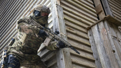 Military personnel armed with HK416 assault rifle