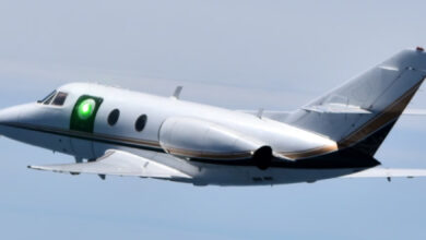 A test aircraft carries the sub-scale HARDROC beam director illuminated by a low-power scoring laser during an experimentation flight August 12, 2022. The HARDROC program evaluated in flight the ability of various aerodynamic flow control techniques to mitigate optical and mechanical distortions imparted on a laser beam leaving an airborne platform travelling at high speeds. (Courtesy photo)