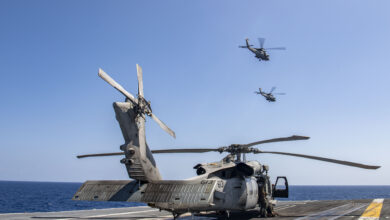 230512-N-BI507-1130 PHILIPPINE SEA (May 12, 2022) Two MH-60R Sea Hawk helicopters from the "Battlecats" of Helicopter Maritime Strike Squadron (HSM) 73 fly near the aircraft carrier USS Nimitz (CVN 68) during an aerial change of command ceremony. Nimitz in U.S. 7th Fleet conducting routine operations. 7th Fleet is the U.S. Navy's largest forward-deployed numbered fleet, and routinely interacts and operates with allies and partners in preserving a free and open Indo-Pacific region. (U.S. Navy photo by Mass Communication Specialist 3rd Class Carson Croom)