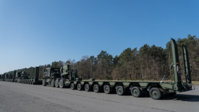 U.S. Army Enhanced Heavy Equipment Transporter Systems line up for a convoy, in a staging area of the Army Prepositioned Stock-2 site, in Zutendaal, Belgium, Mar. 09, 2022. Army Prepositioned Stocks is a U.S. Department of the Army program in which equipment sets are stored around the globe for use when a combatant commander requires additional capabilities. The U.S. Army has seven APS regions and APS-2 is designated for Europe. APS sites reduce deployment timelines, improve deterrence capabilities, and provide additional combat power for contingency operations. (U.S. Army photo by Pierre-Etienne Courtejoie)