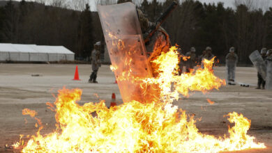 Soldiers with the 1st Battalion, 149th Infantry, Charlie Company conduct fire phobia Crowd Riot Control training (CRC) from their Slovenian instructors at the Joint Multinational Readiness Center (JMRC) in Hohenfels, Germany Feb. 11, 2022. Fire phobia training is meant to familiarize Soldiers with response to an improvised incindiery device, Molotov cocktail, in a riot control situation. (U.S. Army National Guard photo by Spc. Alexander Hellmann)