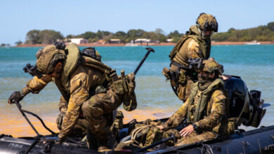 Australian Army soldiers arrive at Melville Island, Northern Territory, by Zodiac after a patrolling around the waters of Darwin as part of Exercise Predators Run 23