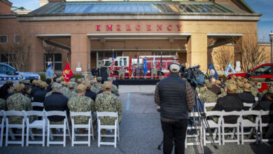 Surgeon General of the Navy Rear Adm. Darin Via speaks during a trauma center ribbon cutting ceremony in front of Naval Medical Center Portsmouth’s (NMCP) emergency room entrance on Dec. 8. The trauma center ribbon cutting was held in celebration of NMCP becoming the Navy’s first level two trauma center. (U.S. Navy photo by Mass Communication Specialist 2nd Class Dylan M. Kinee/Released)