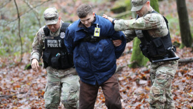 Sgt. Alexander Farnum and Staff Sgt. Renaldo Rameriez, with the 92nd Military Police Company “Rock Solid”, arrest and escort the captured escapee back towards the waiting MP vehicle during a missing prisoner emergency action plan exercise on Sembach Kaserne, Germany, on Dec. 14, 2023. The exercise was used to highlight the readiness of the facility’s military and partner organizations in the event a prisoner escapes custody.