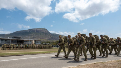 Australian Army soldiers from the 3rd Brigade march towards Brigade Headquarters as part of the 3rd Brigade Section Competition presentation at Lavarack Barracks, Townsville, Queensland. *** Local Caption *** The 3rd Brigade Section Competition was held at Lavarack Barracks, Mount Stuart Training Area and Tully Training Area, QLD, between 17-19 Oct 2023. The competition involved eight sections from within the Brigade testing themselves over a series of military skills stands. Stands included the obstacle course, marksmanship serials, casualty evacuation medical training, military flotation, section attack, section defence, communications, navigation, obstacle deduction and all arms call for fire with artillery assets.
