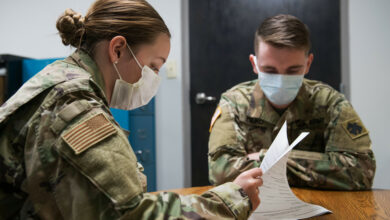 Airman Madison Hilton (left), a member of the Oklahoma Air National Guard's 138th Fighter Wing and Oklahoma Army National Guard Spc. Phillip Dimko (right), 120th Engineering Battalion, review documents for COVID-19 contact tracing on May 21, 2020 in Muskogee, Oklahoma. On May 21, there were eight members of the Oklahoma National Guard working contact tracing in Muskogee in order to advise individuals who may have been exposed to COVID-19 and provide them with necessary information on symptoms to look for, as well as testing sites if needed. (Oklahoma Air National Guard photo by Tech. Sgt. Rebecca Imwalle)