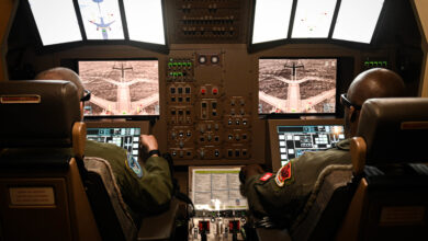 U.S. Air Force Master Sgt. Joseph Vondohlen (left), 54th Air Refueling Squadron boom operator instructor, and Tech. Sgt. Marcus, 432nd Air Expeditionary Wing evaluator sensor operator, practice in-flight air refueling in a Boom Operator Training (BOT) simulator at Altus Air Force Base, Oklahoma, March 9, 2022. BOT is a new simulation system the 97th Air Mobility Wing uses to train boom operators to refuel from the KC-46 Pegasus. (U.S. Air Force photo by Senior Airman Kayla Christenson)