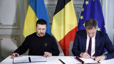 Ukraine's President Volodymyr Zelensky and Belgian Prime Minister Alexander De Croo sign a bilateral security accord in Brussels on May 28, 2024