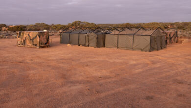 Australian Army Role 2 Basic field hospital set up by the 3rd Health Battalion during Exercise Rhino Run at Cultana Training Area. *** Local Caption *** The 3rd Health Battalion deployed their Role 2 Basic into the field environment on Exercise Rhino Run 2024. The Role 2 Basic is a manoeuvrable and deployable field hospital designed to offer urgent medical care, including resuscitation, surgery and critical care post-evacuation via medics in the field. The Role 2 Basic is suitable for all shape, deter and respond operations and is able to be deployed at short notice due to its ease of movement. Exercise Rhino Run 2024 is the culminating force generation event for the 9th Brigade in 2024 involving 1st Armoured Regiment, 7th Battalion, the Royal Australian Regiment, 10th/27th Battalion, Royal South Australia Regiment, 9th Combat Service Support Battalion, Headquarters 9th Brigade personnel, and equipment external supports from 3rd Health Battalion and United States Marine Corps. The activity includes a number of carefully synchronised unit live and dry fire activities in the Cultana Training Area (CUTA) with Direct Command Units working together to deliver individual and team training outcomes through supported and supporting arrangements.