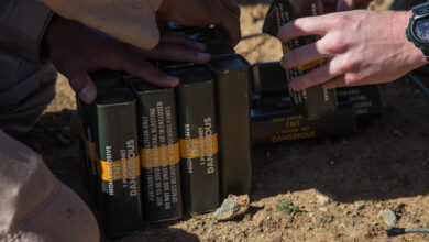 U.S. Marines with 1st Explosive Ordnance Disposal Company, 7th Engineer Support Battalion, 1st Marine Logistics Group, partner with Orange County Sheriff’s Department Hazardous Devices Section to set explosive charges during the Post-Blast Analysis Course at Camp Pendleton, Calif., April 11, 2018. The Marines and sheriffs prepare charges of trinitrotoluene (TNT) to be placed in the ground before detonation. (U.S. Marine Corps Photo by Lance Cpl. Quentarius Johnson)
