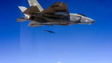 An F-35C aircraft performs a dual, external release of a GBU-54.