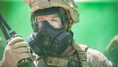 UNDISCLOSED LOCATION, MIDDLE EAST – U.S. Marine Corps Cpl. Jamie M. Greenfield, an infantry assault Marine with 3rd Battalion 7th Marine Regiment, attached to Special Purpose Marine Air-Ground Task Force, Crisis Response-Central Command, operates a radio during a simulated gas attack July 25, 2018. The Marines exercised their chemical, biological, radiological, and nuclear defense training during exercise Lucky Seahorse. (U.S. Marine Corps photo by Cpl. Teagan Fredericks)