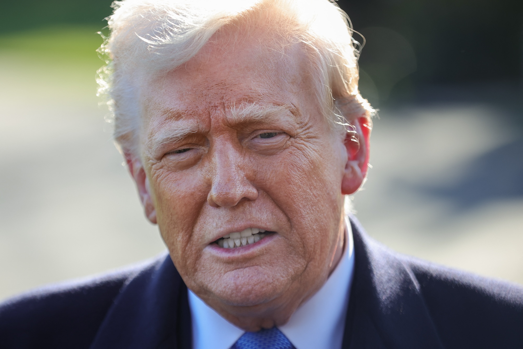 US President Donald Trump speaks to reporters at the White House