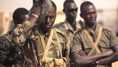 A Nigerian soldier wipes sweat off his face while participating in a special forces training exercise during Exercise Flintlock 2018 in Agadez, Niger, April 14, 2018. Flintlock is an annual, African-led, integrated military and law enforcement exercise working with multinational special operations groups. The exercise is designed to strengthen the ability of key partner nations in the region to counter violent extremist organizations, protect their borders, and provide security for their people. (U.S. Navy photo by MC3 (SW/AW) Evan Parker/Released)