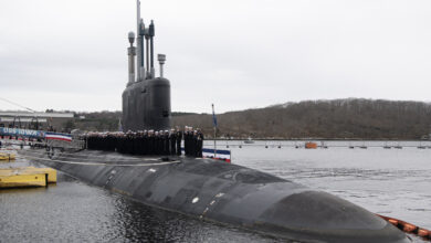 250405-N-UM744-1005- Sailors assigned to the Virginia-class fast attack submarine USS Iowa (SSN 797) man the rails during a commissioning ceremony at Naval Submarine Base New London in Groton, Conn. on April 5, 2025. SSN 797, the third U.S. Navy vessel to be named for “The Hawkeye State”, operates under Submarine Squadron (SUBRON) FOUR, whose primary mission is to provide attack submarines that are ready, willing, and able to meet the unique challenges of undersea combat and deployed operations in unforgiving environments across the globe. (U.S. Navy photo by John Narewski)