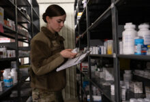 Senior Airman Laura Fitzpatrick, 8th Healthcare Operations Squadron medical material technician, examines pharmaceuticals at Kunsan Air Base, Republic of Korea, June 12, 2024. Fitzpatrick was recognized as Pride of the Pack for managing the HCOS’s Self-Life Extension Program. (U.S. Air Force photo by Senior Airman Maria Umanzor Guzman)