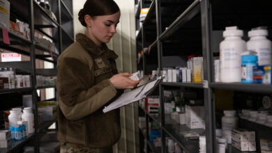Senior Airman Laura Fitzpatrick, 8th Healthcare Operations Squadron medical material technician, examines pharmaceuticals at Kunsan Air Base, Republic of Korea, June 12, 2024. Fitzpatrick was recognized as Pride of the Pack for managing the HCOS’s Self-Life Extension Program. (U.S. Air Force photo by Senior Airman Maria Umanzor Guzman)