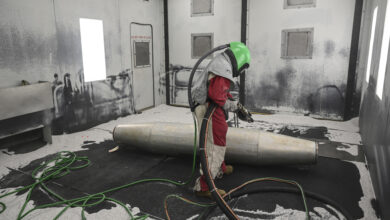U.S. Air Force Senior Airman Leonard Jacob, 33rd Maintenance Squadron low obersaverables aircraft structural maintenance journeyman, conducts media blasting operations Sept. 13, 2021 at Eglin Air Force Base, Florida. Media blasting operations removes paint and corrosion, allowing the nondestructive inspection shop to inspect the part for damage before it is recoated and painted. (U.S. Air Force photo by Senior Airman Heather LeVeille)