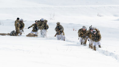 U.S. Army paratroopers assigned to the 3rd Battalion, 509th Parachute Infantry Regiment, 2nd Infantry Brigade Combat Team (Airborne), 11th Airborne Division, move across a snow-filled landing zone during Joint Pacific Multinational Readiness Center-Alaska 23-02 at Yukon Training Area, Ft. Wainwright, Alaska, March 28, 2023. With more than 8,000 participants and observers from 12 different countries, JPMRC-AK 23-02’s multinational environment helps increase Arctic proficiency throughout the Army and the joint force, in support of the nation’s, and the Army’s Arctic strategy. (U.S. Air force photo by Senior Airman Patrick Sullivan)