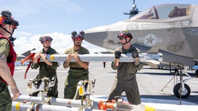 250603-N-FC892-1158 PHILIPPINE SEA (June 3, 2025) Marines, assigned to the 31st Marine Expeditionary Unit (MEU), prepare to load an AIM-9X missile on the flight deck of the forward-deployed amphibious assault ship USS America (LHA 6) while in the Philippine Sea, June 3. America, lead ship of the America Amphibious Ready Group, is operating in the U.S. 7th Fleet area of operations. U.S. 7th Fleet is the U.S. Navy’s largest forward-deployed numbered fleet, and routinely interacts and operates with allies and partners in preserving a free and open Indo-Pacific region. (U.S. Navy photo by Mass Communication Specialist 2nd Class Cole Pursley)