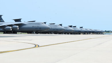 A group of C-5M Super Galaxy aircraft sits on the flightline June 3, 2025, at Dover Air Force Base, Delaware. The C-5M, with a cargo load of 281,001 pounds, can fly 2,150 nautical miles, offload and fly to a second base 500 nautical miles away from the original destination without aerial refueling. With aerial refueling, the C-5M's range is limited only by crew endurance. (U.S. Air Force photo by Jeremy Larlee)