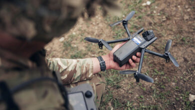 A British soldier operating a parrot drone during exercise HEDGEHOG.