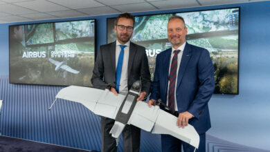 Airbus and Quantum Systems officials holding an unmanned aerial system