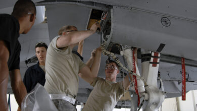 Maintainers at Moody Air Force Base prepare to inspect an A-10 Thunderbolt II for wing frame cracks