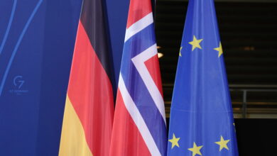 19 January 2022, Berlin: The flags of Germany, Norway and the EU are displayed at the Federal Chancellery. Norway's Prime Minister Store and Chancellor Scholz (SPD) make statements before their joint talks at the Chancellor's Office. Photo: Kay Nietfeld/dpa (Photo by KAY NIETFELD / dpa Picture-Alliance via AFP)