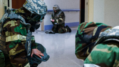 U.S. Air Force Airmen from the 31st Medical Group shelter from a simulated attack during Exercise Fighting Wyvern 25-01 at Aviano Air Base, Italy, March 11, 2025. Fighting Wyvern is a large-scale Combat Readiness Exercise designed to enhance Agile Combat Employment and ensure forces are ready to rapidly deploy, operate and sustain combat airpower under adverse conditions. (U.S. Air Force photo by Airman 1st Class Zachary Jakel)