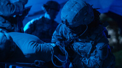 U.S. Army Sgt. Marilyn Harris, assigned to 41st Field Artillery Brigade, listens for a pulse from a battalion aid station after an opposition forces attack during Saber Guardian 25, Cincu Training Area, Romania, June 13, 2025. The aid station enables rapid triage, treatment, and evacuation of casualties, ensuring readiness and lifesaving support in austere operational environments. (U.S. Army photo by Spc. Hunter Carpenter) Demonstrating global deterrence and the U.S. Army’s ability to rapidly deploy U.S.-based combat power in Europe and the Arctic region alongside Allies and partners, DEFENDER 25 brings U.S. troops together with forces from 29 Allied and partner nations to build readiness through large-scale combat training from May 11-June 24, 2025. DEFENDER 25 increases the lethality of the NATO alliance through large-scale tactical training maneuvers and long-range fires, builds unit readiness in a complex joint, multinational environment and leverages host nation capabilities to increase the U.S. Army’s operational reach. During three large-scale combat training exercises—Swift Response, Immediate Response, and Saber Guardian—Ally and partner forces integrate and expand multi-domain operations capability, demonstrating combined command and control structures and readiness to respond to crisis and conflict.