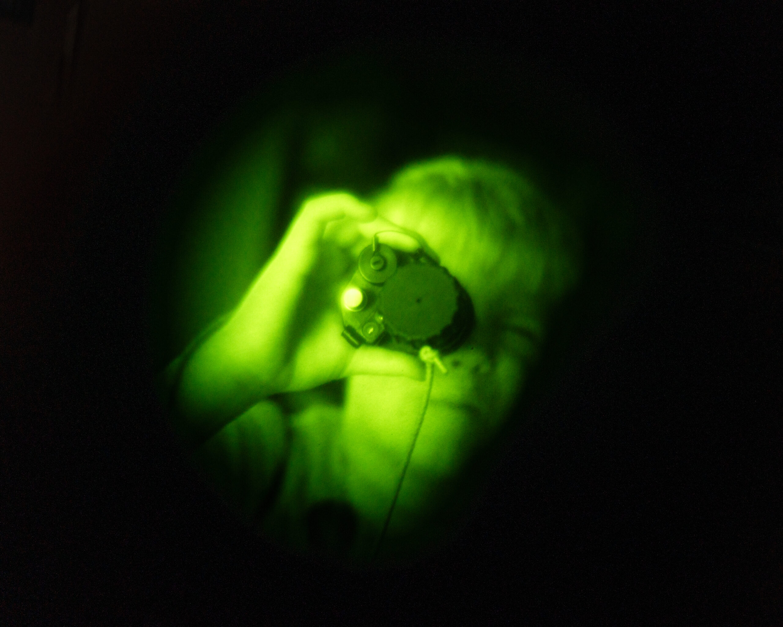 An attendee utilizes night vision during an Operation KUDOS event July 11, 2025, at Joe Foss Field, South Dakota. Operation KUDOS is designed to allow children the chance to learn about different military operations and deployments. (U.S. Air National Guard photo by Staff Sgt. Taylor Solberg)