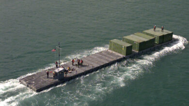 981019-A-6207H-528 A U.S. Army Modular Causeway System transports containers of Army equipment from the USNS Pollux to a pier in the harbor of Pusan, Republic of Korea, on Oct. 19, 1998, for Exercise Foal Eagle Ô98. Foal Eagle Ô98 is a combined, joint exercise supported by forces from the U.S. and Republic of Korea. In addition to providing hands-on field experience for forces of both nations, Foal Eagle Ô98 was designed to test rear area protection operations and major command, control and communications systems. Pollux is one of eight Fast Sealift Ships belonging to the Military Sealift Command that have special features allowing them to load and off-load cargo in places lacking normal port facilities. Causeway systems are deployable aboard container ships and other cargo vessels as the Pollux. DoD photo by Spc. Christina Ann Horne, U.S. Army. (Released)
