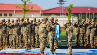 U.S. Army soldiers assigned to the 528th Military Intelligence Company, 2nd Infantry Division/ROK-U.S. Combined Division, uncase the unit guidon during the unit's activation ceremony August 5, 2025, on Camp Humphreys, South Korea. The ceremony was held to commemorate the establishment of the new unit within the 2nd Infantry Division/ROK-U.S. Combined Division. (U.S. Army photo by Pfc. Wilfred Salters Jr.)