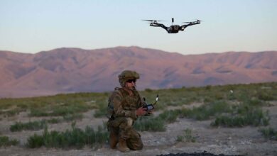A US soldier operates a drone.