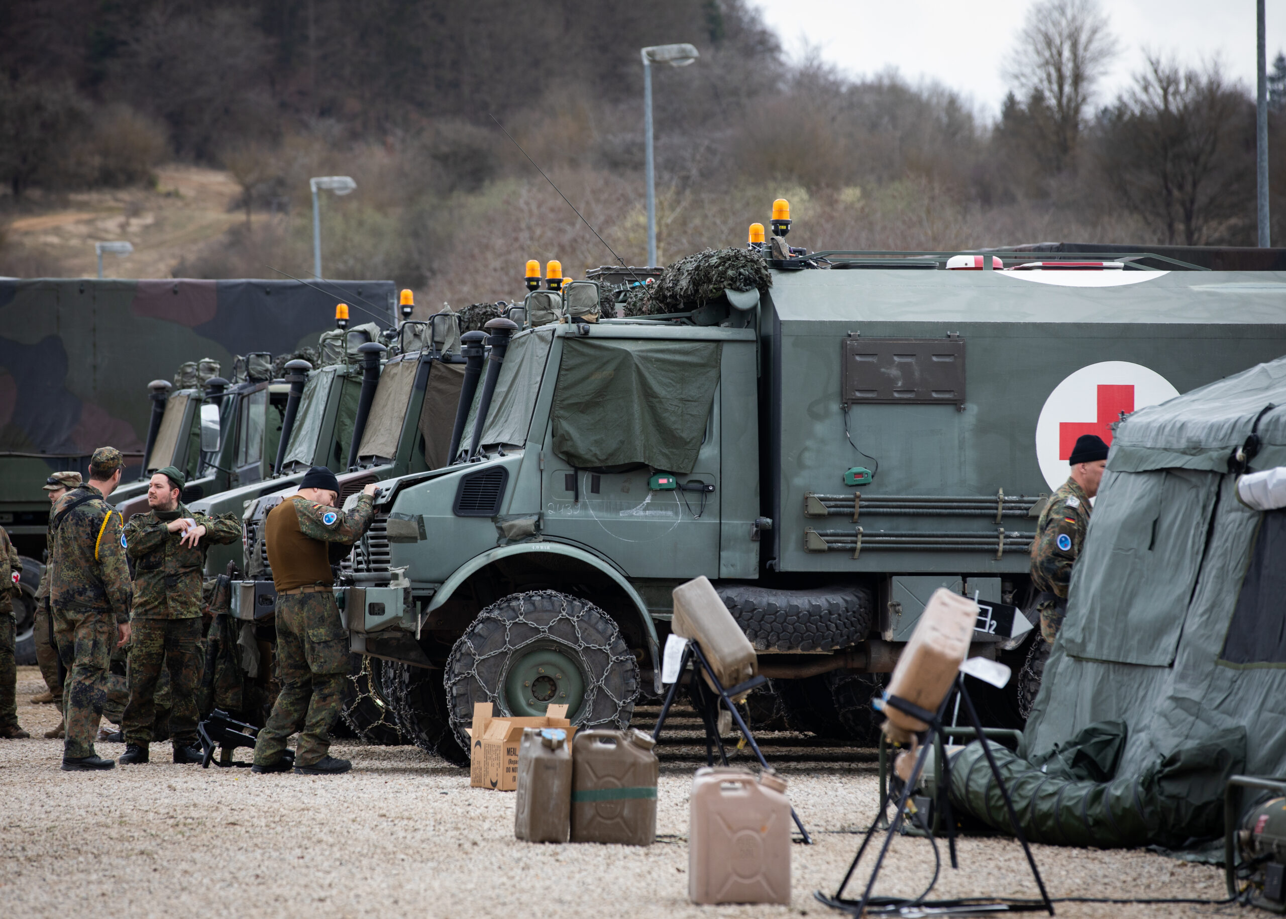 Soldiers with the German Forces Joint Medical Service conduct vehicle preventive maintenance checks and services to ensure movement readiness during Exercise Allied Spirit in Hohenfels, Germany, Mar. 14, 2024. This multinational training exercise gathered medical units from the U.S. Army Reserve, the 30th Medical Brigade, and German partners to provide NATO Role 2B field operational capabilities including evacuation, triage and resuscitation, treatment and holding of patients until they can be returned to duty or evacuated, emergency dental treatment, emergency surgery and essential post-operative management. The 7th Mission Support Command is the U.S. Army Reserve presence in Europe. Comprised of 26 units across Germany and Italy, the 7th MSC provides logistics and sustainment resources in support of U.S. Army Europe and Africa missions across the theater. For more stories and information on the 7th Mission Support Command, follow us on Facebook @7thMSC. (U.S. Army Reserve photo by Spc. Kirsti Beckett)