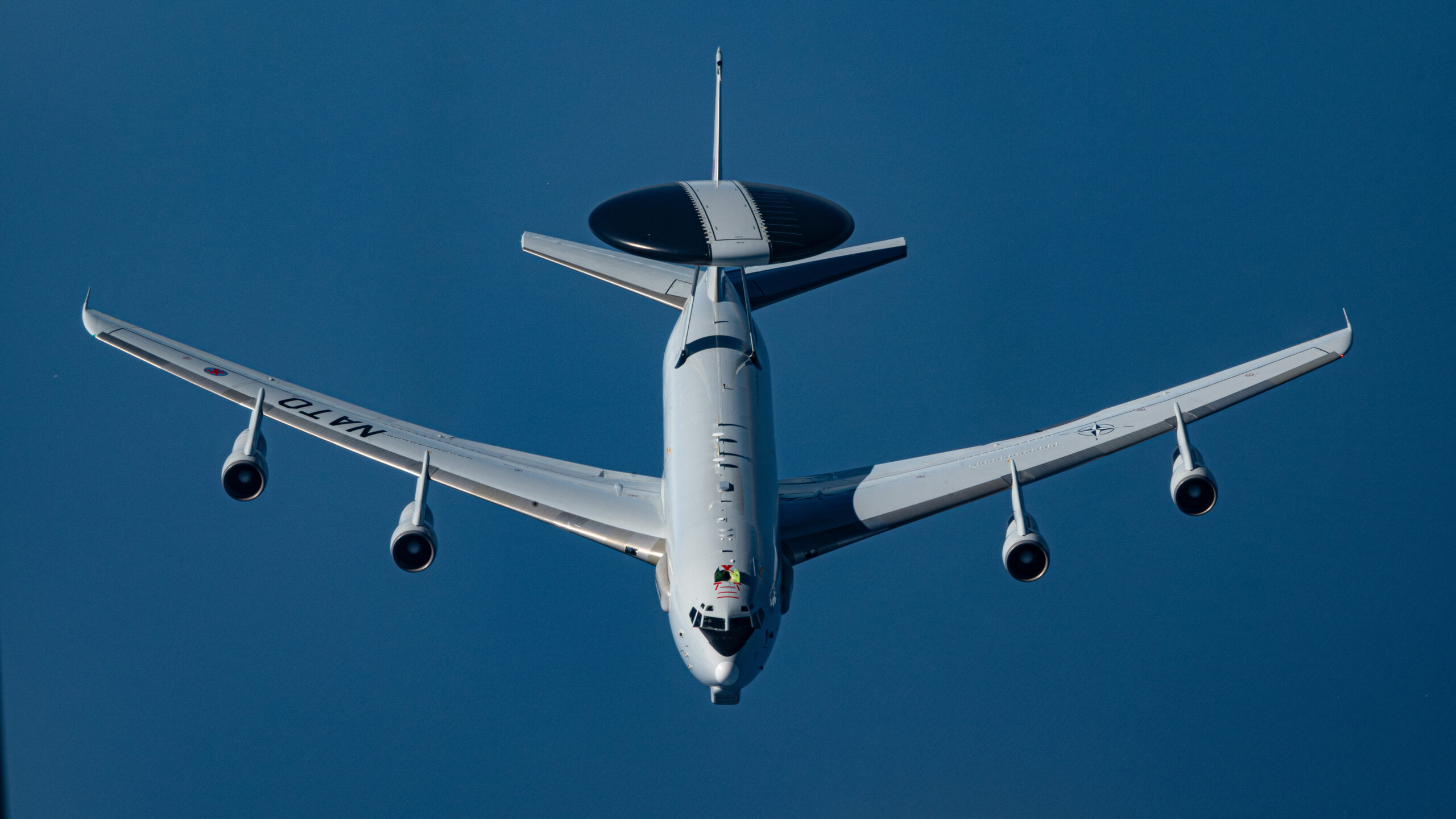 A NATO E-3 Sentry approaches a KC-135 Stratotanker from the 100th Air Refueling Wing during an aerial refueling mission over Spain, July 2, 2025. The E-3 is an airborne early warning and control aircraft that aims to protect allies by detecting and tracking hostile aircraft. (U.S. Air Force photo by Airman 1st Class Aidan Martínez)