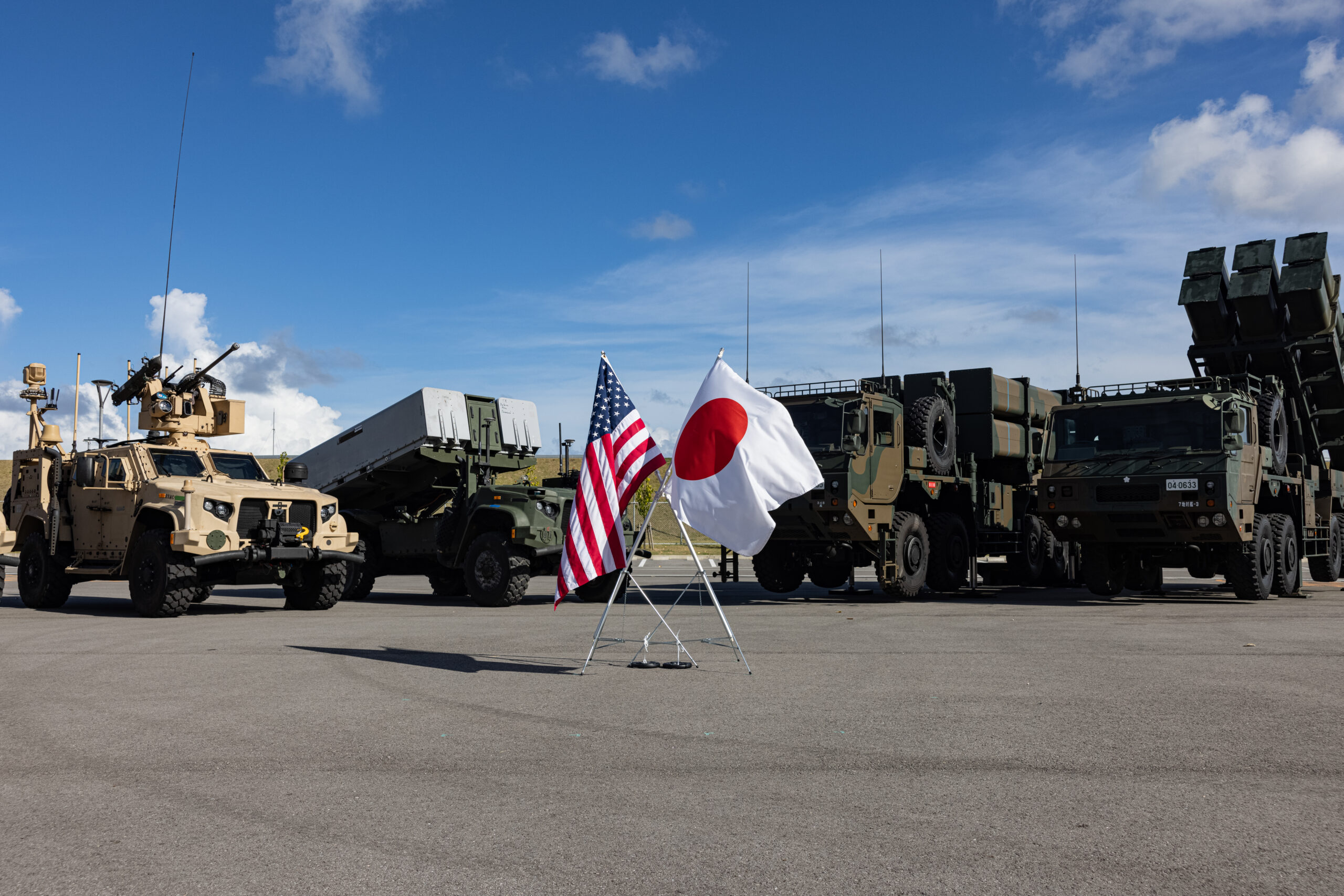 A U.S. Marine Air Defense Integrated System, far left, a Navy-Marine Expeditionary Ship Interdiction System, left, a Japan Self-Defense Force Type 12 Surface-to-Ship Missile, right, and Type 03 Medium-Range Surface-to-Air Missile are displayed at a press conference during Resolute Dragon 25 at Japan Ground Self-Defense Force Camp Ishigaki, Okinawa, Japan, Sept. 17, 2025. Resolute Dragon 25 is an annual bilateral exercise in Japan that strengthens the command, control, and multi-domain maneuver capabilities of U.S. Marines in III Marine Expeditionary Force and Japan Self-Defense Force personnel, with a focus on controlling and defending key maritime terrain. The NMESIS and the MADIS are 3rd Marine Division Assets. The Type 12 SSM and the Type 03 Medium-Range Surface-to-Air Missile are Western Army assets. (U.S. Marine Corps photo by Cpl. Evelyn Doherty)