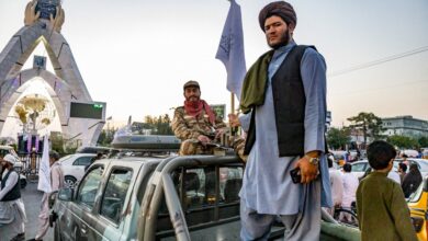 Taliban personnel riding a car in Afghanistan