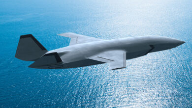 gray-mq28-boeing-flying-over-blue-water