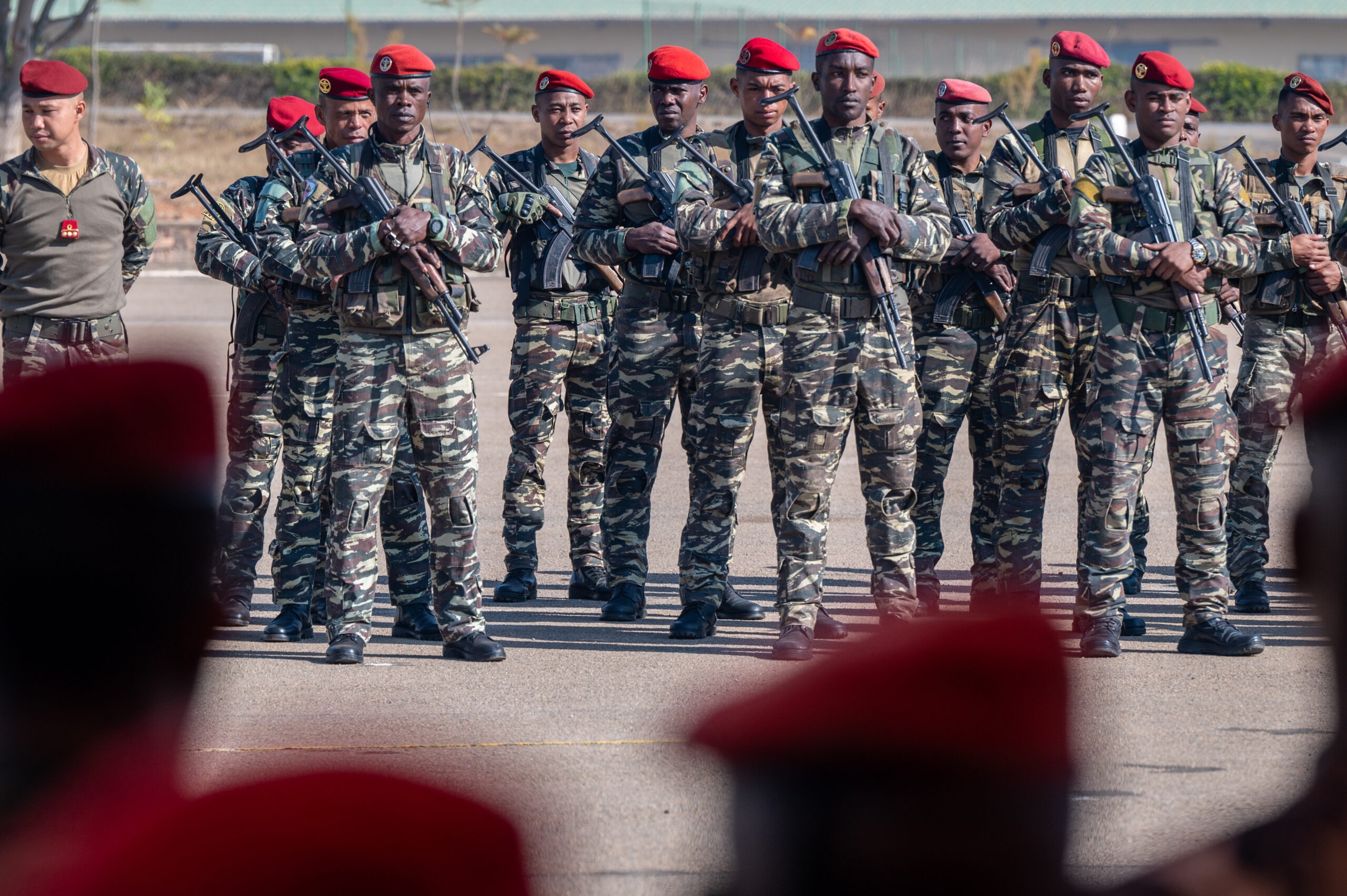 Members of the Malagasy Ministry of Armed Forces 1st Battalion Parachutists stand in formation during the opening ceremony for a Joint Combined Exchange Training with the U.S. Army 3rd Special Forces Group (Airborne) near Antananarivo, Madagascar, July 26, 2024. JCETs enhance U.S. relationships with partner nations by developing and maintaining critical military-to-military connections and improving joint and allied readiness and interoperability. (U.S. Air Force photo by Staff Sgt. Jennifer Healy)