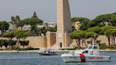 Coast Guard attend the arrival of the MSF's (Doctors Without Borders) Geo Barents ship at the Italian port of Brindisi on September 19, 2023, carrying 471 migrants, including 173 minors, one of whom was less than a year old. The migrants will be transferred to active hotspots in Puglia but also in Lombardy, Piedmont and Emilia Romagna. (Photo by Manuel Romano/NurPhoto) (Photo by Manuel Romano / NurPhoto via AFP)
