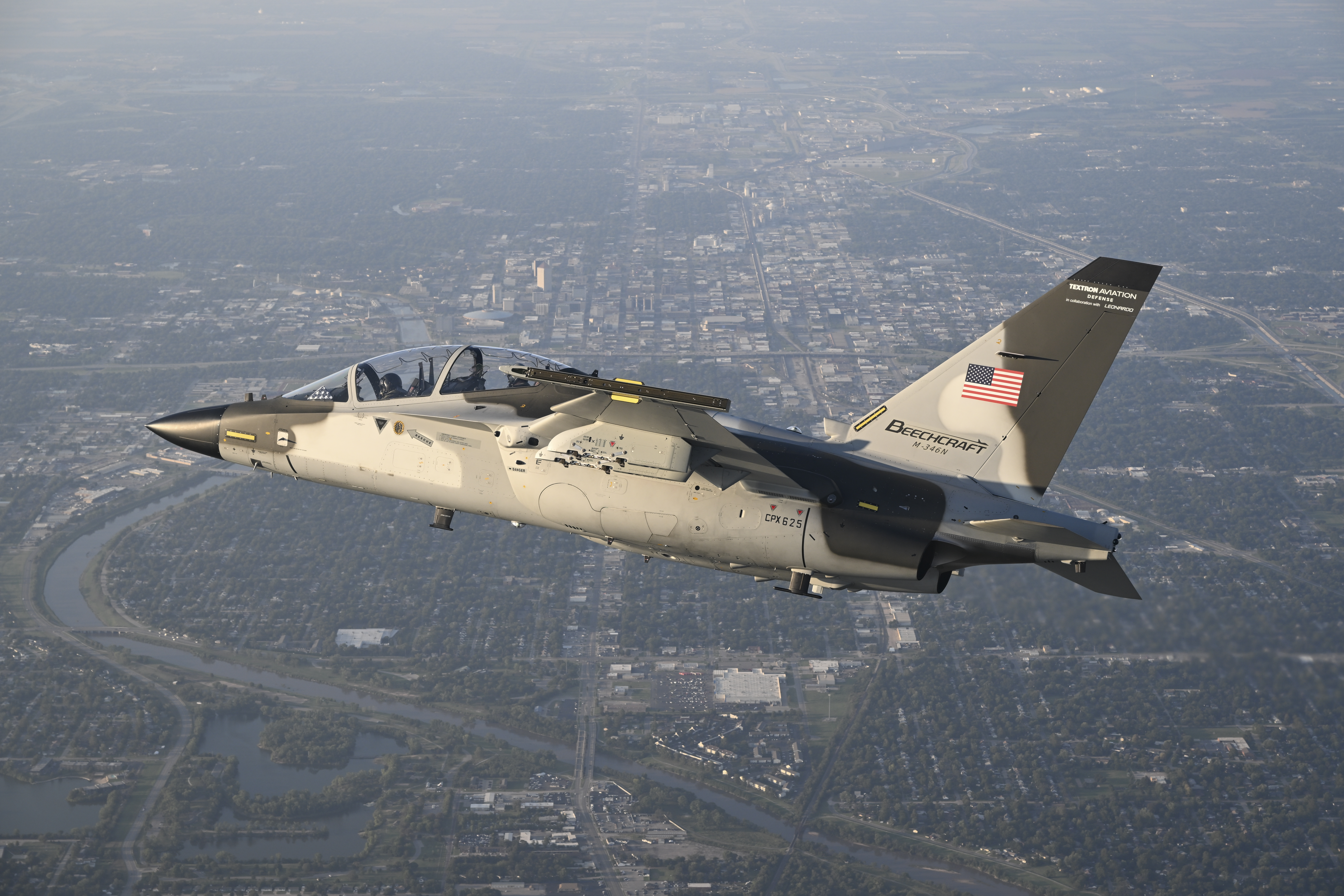 The M-364N aircraft. Photo: Textron Aviation Defense Beechcraft M-346N in-flight over Wichita, Kansas and surrounding area on Sept. 15, 2025. The aircraft is being flown by Leonardo test pilots Quirino Bucci, front seat, and Emiliano Battistelli, back seat, wtih chase from a Beechraft AT-6E Wolverine flown by Textron Aviation Engineering/Defense Chief Pilot Stuart Rogerson. (Textron Aviation photos by Greg L. Davis) The M-346N is the proposed replacement for the T-45 Goshawk jet trainer for the U.S. Navy's Undergraduate Jet Training System and a product prepared for competition by Beechcraft in collaboration with Leonardo of Italy.