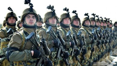 Uzbekistan forces line up.
