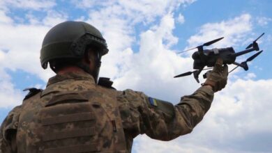 A Ukrainian soldier preparing a drone for use.