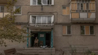 A citizen sitting outside a residential complex in eastern Ukraine.