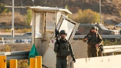 Israeli soldiers secure the site of a reported attack at the Gush Etzion Junction, in the Israeli-occupied West Bank.