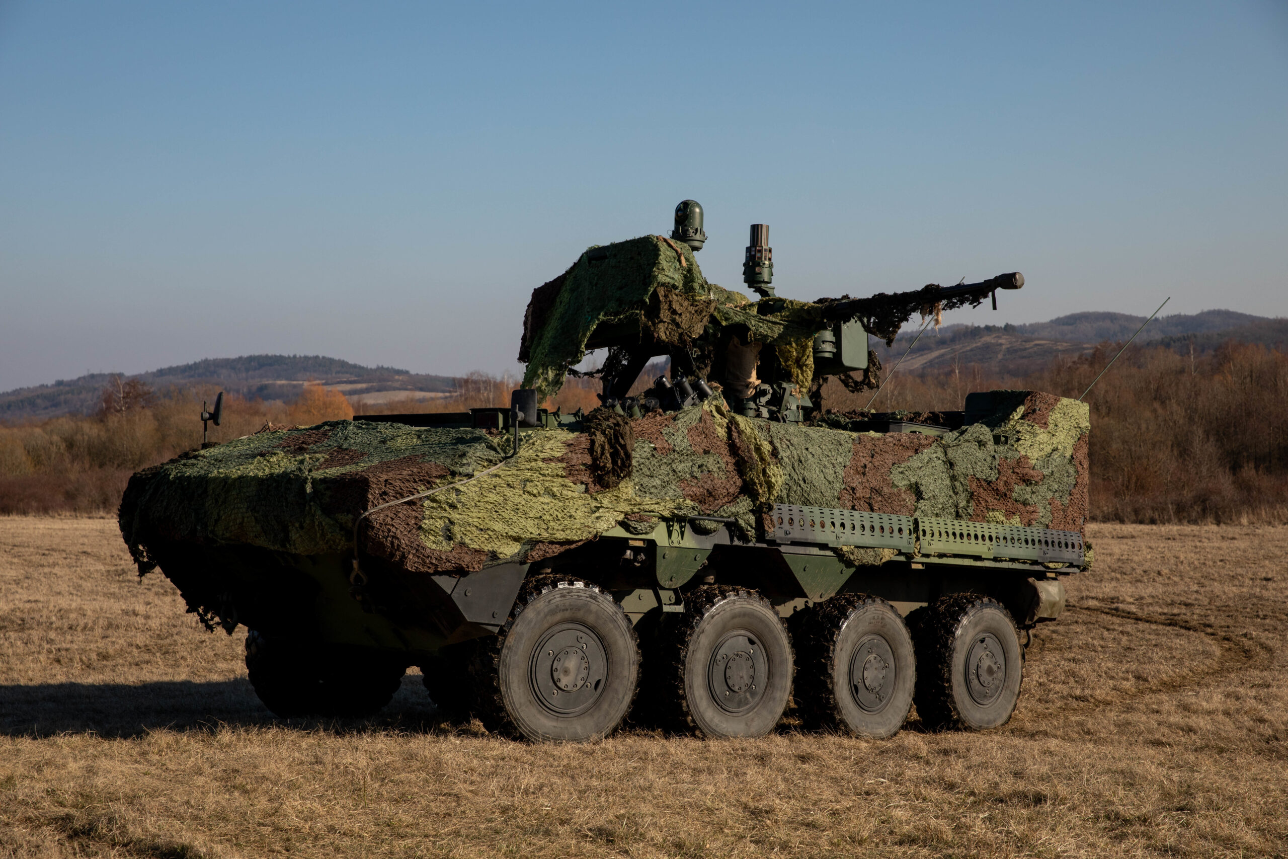 Members of the Czech Army traverse a field in a Pandur II Armored Personnel Carrier, during vehicular movement drills, alongside the 2nd Battalion, 34th Armored Regiment, 1st Armored Brigade Combat Team, 1st Infantry Division, March 1, at Hradiště Military Area in Northwest Czech Republic. The 2/34th is in the Czech Republic training with members of its military to increase readiness and interoperability as part of Saber Strike 22, a large scale, multinational exercise taking place between NATO allies throughout Europe. (U.S. Army National Guard photo by Sgt. 1st Class Timothy Cordeiro)